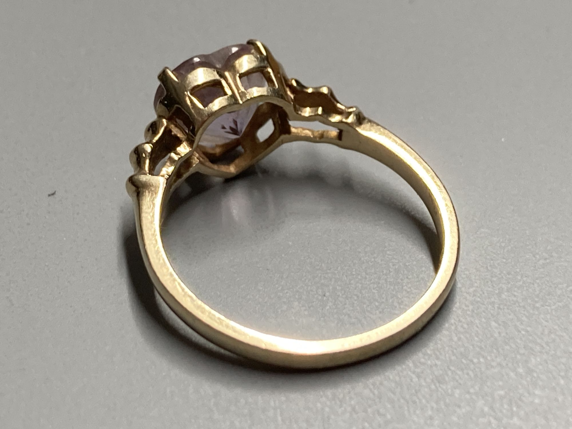 Three assorted modern 9ct gold or 9k gem set dress rings